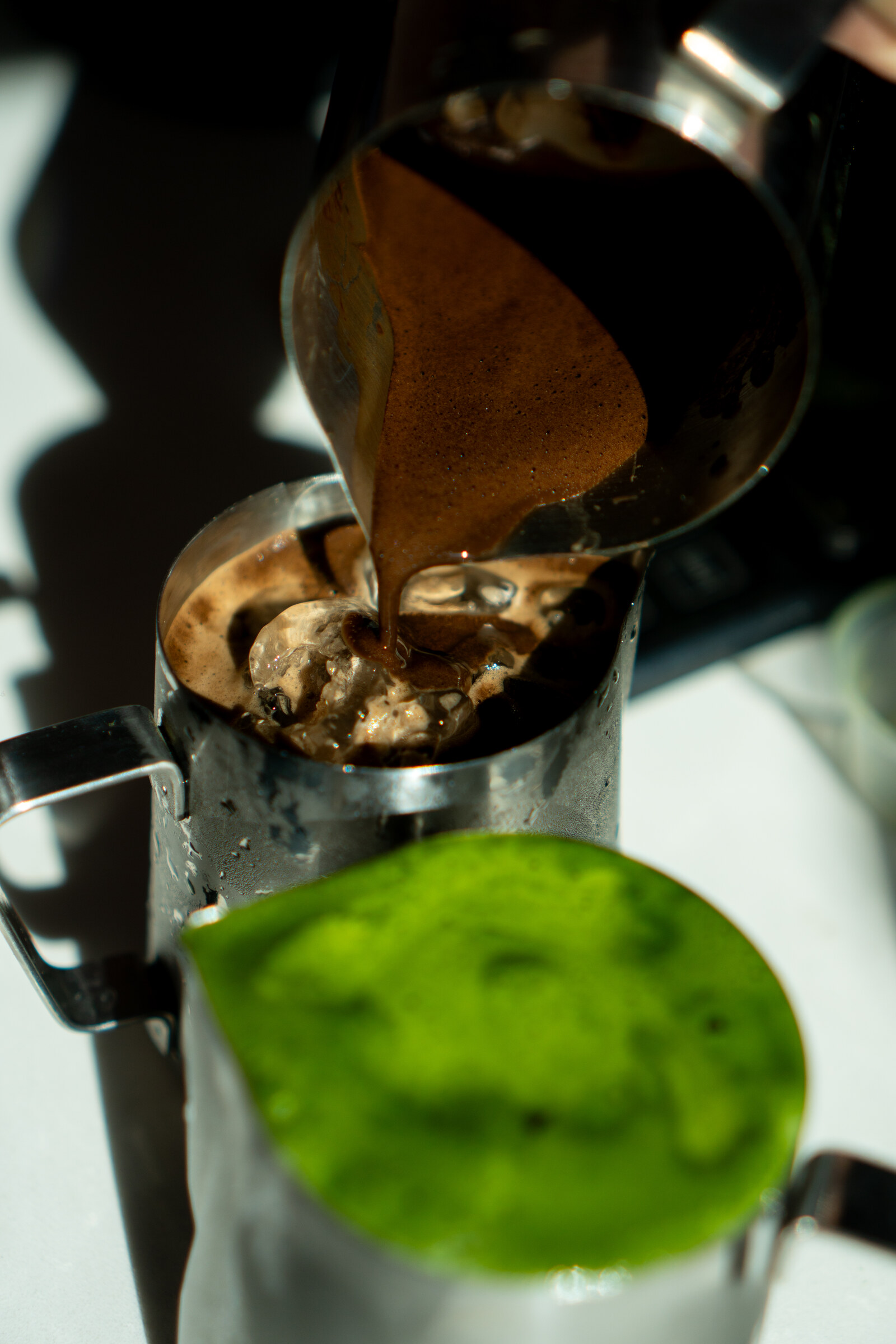 Hojicha being poured over ice