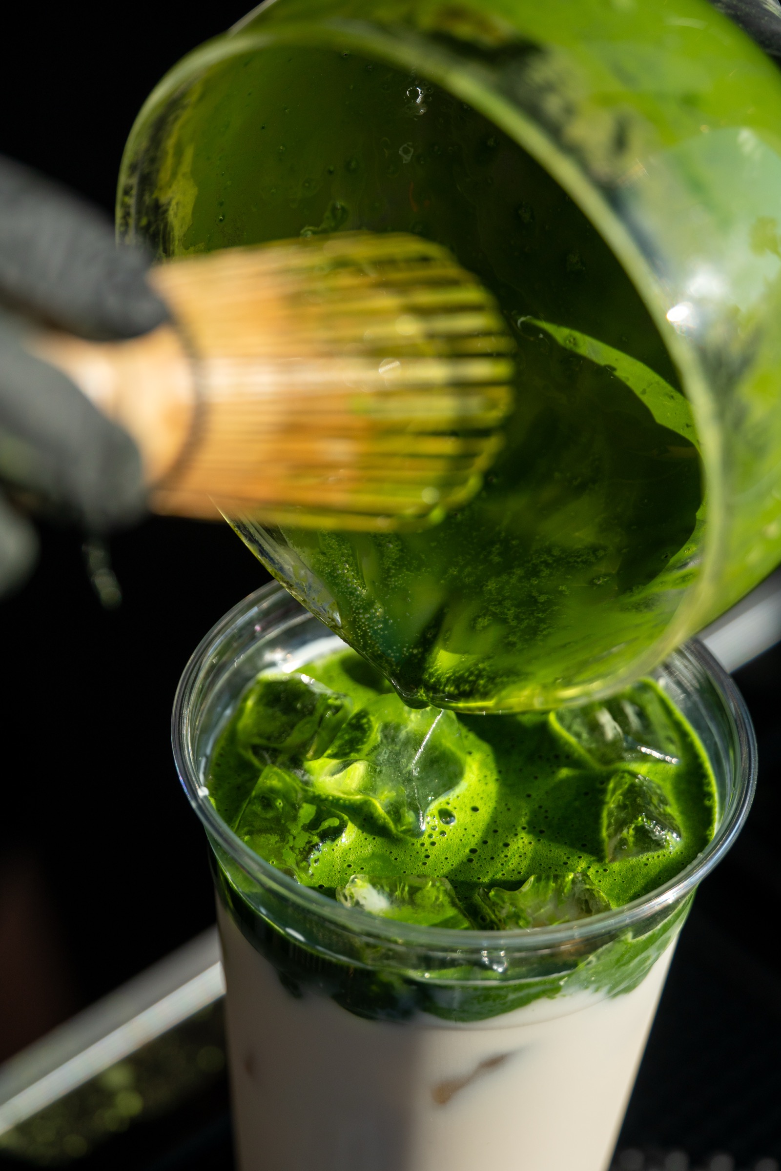 Iro Tea — vibrant matcha poured from a chawan over milk and ice