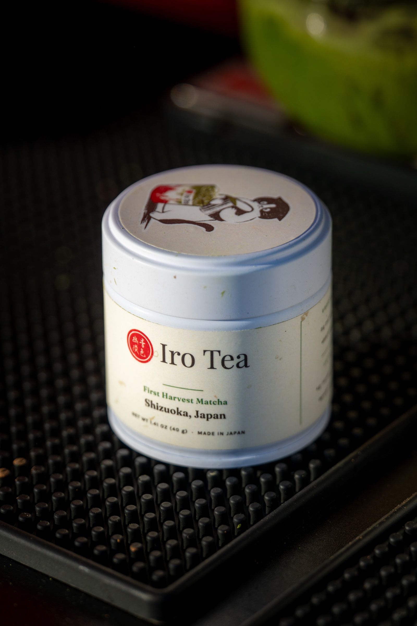 The M099 First Harvest Matcha tin — Iro Tea label, Shizuoka, Japan — on the bar mat