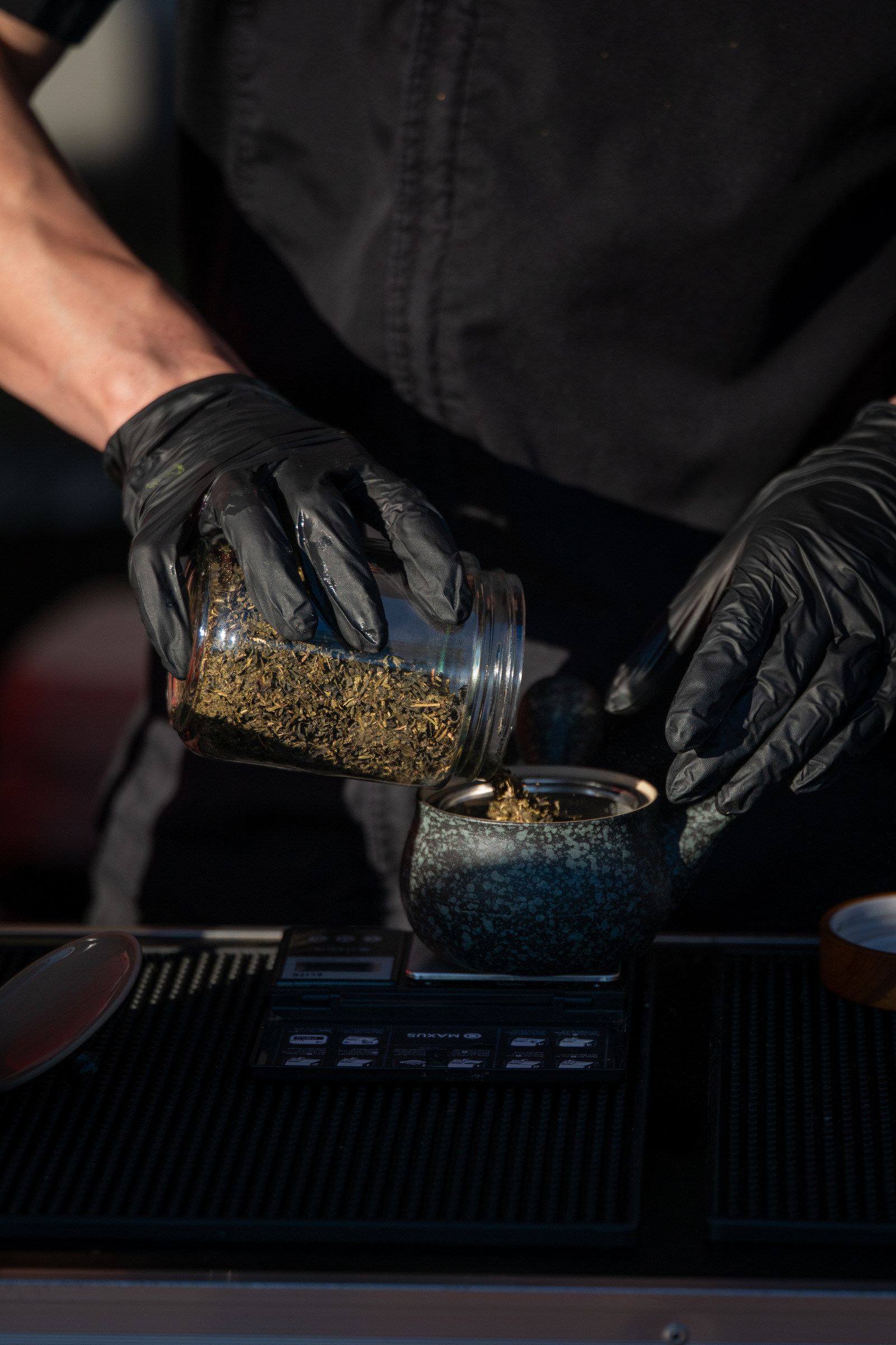 Hot water poured over loose tea leaves in a ceramic kyusu